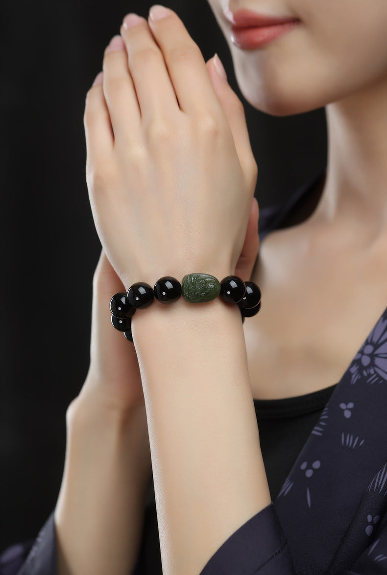 Serene Aegis – Obsidian & Hetian Jade Birth Buddha
