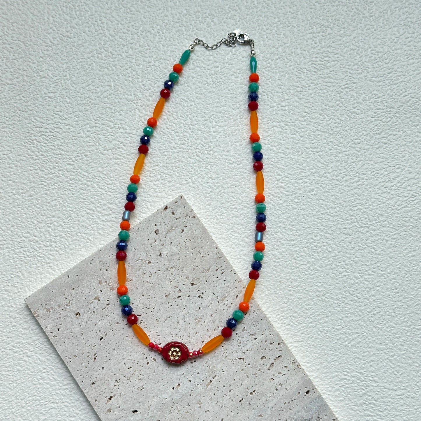 Bright multicolor Sunburst Fiesta Necklace with glass beads in warm fiesta tones, handmade artisan jewelry.