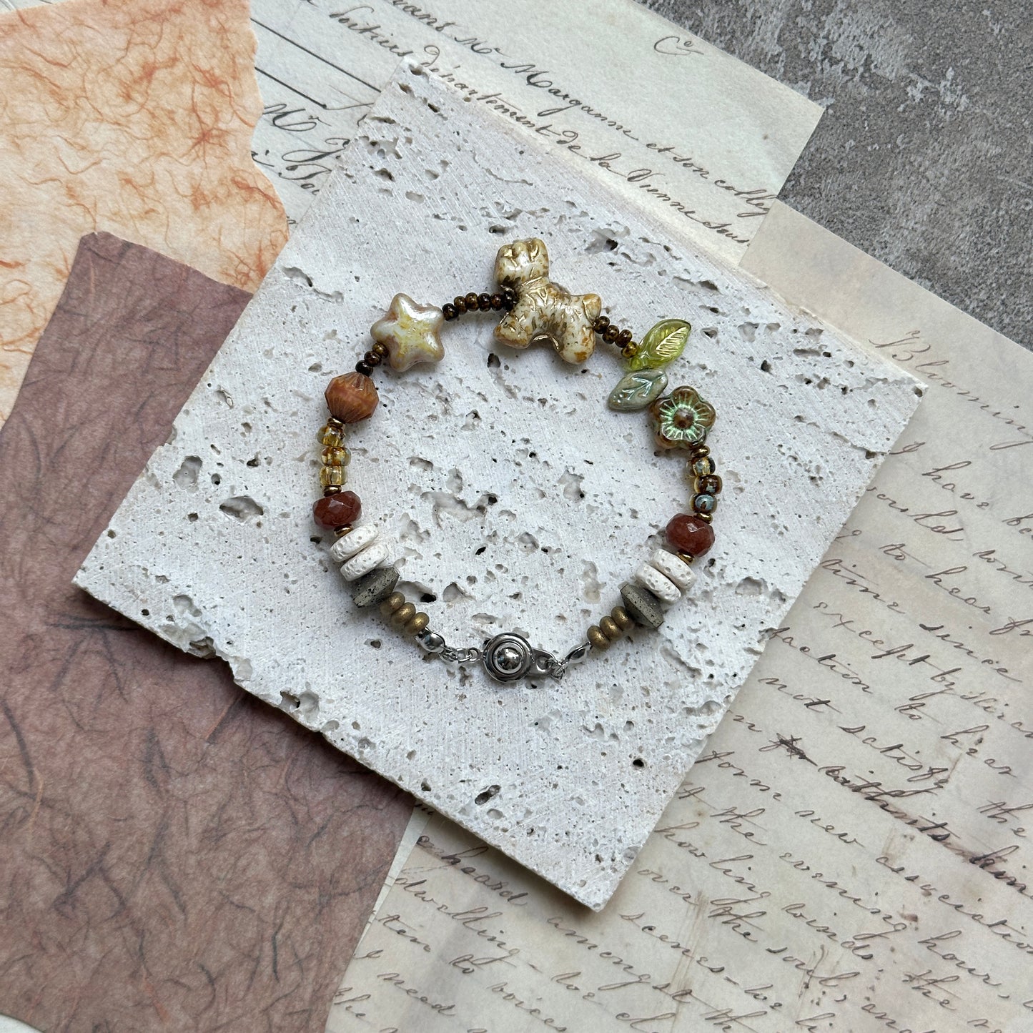 Meadow Pup Bracelet — on-wrist view showing warm amber/neutral palette and playful puppy charm