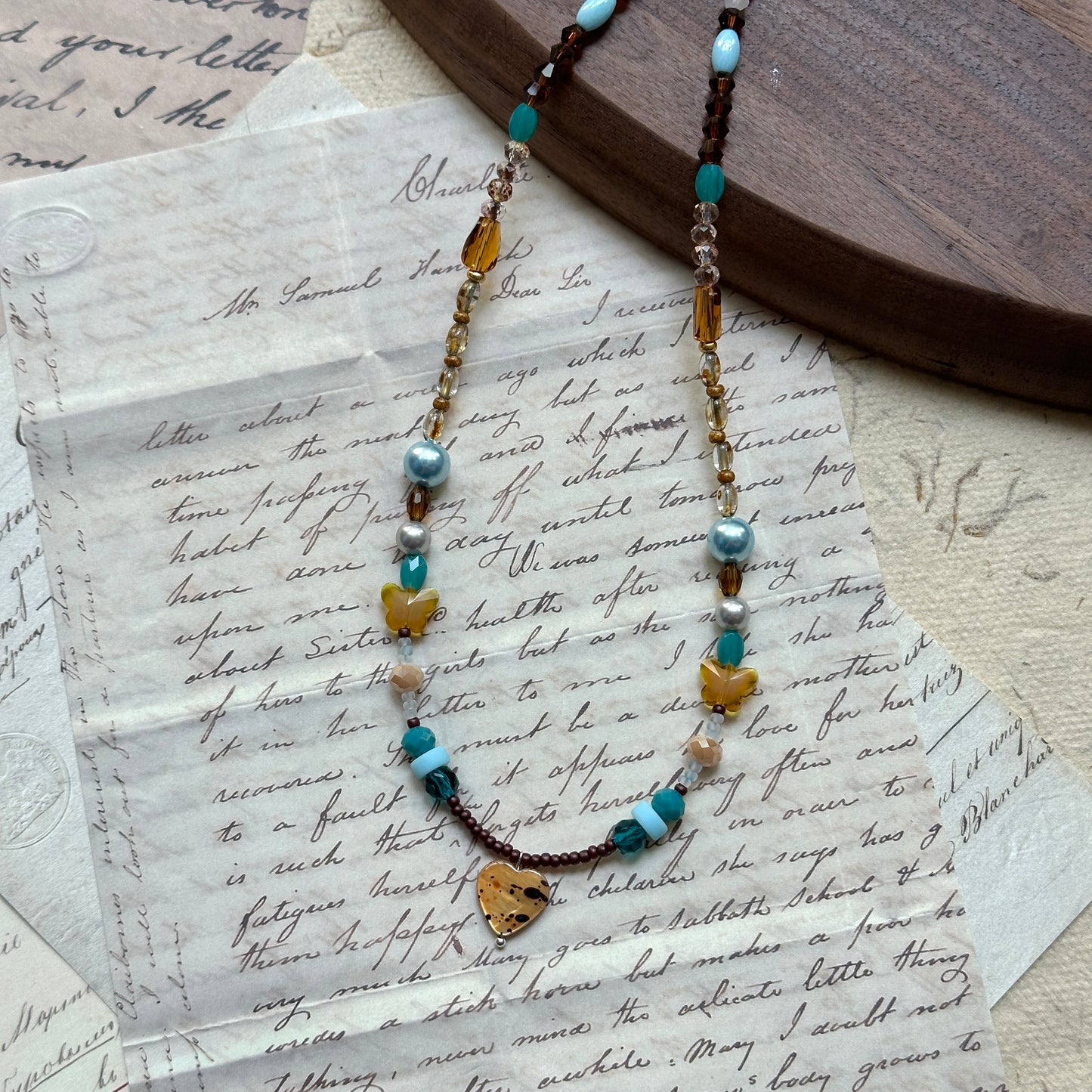 Handmade necklace with amber heart pendant, turquoise and pearl accents – Glazenya
