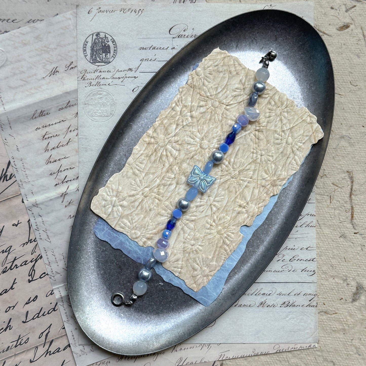 Lightweight handcrafted butterfly bracelet in azure tones
