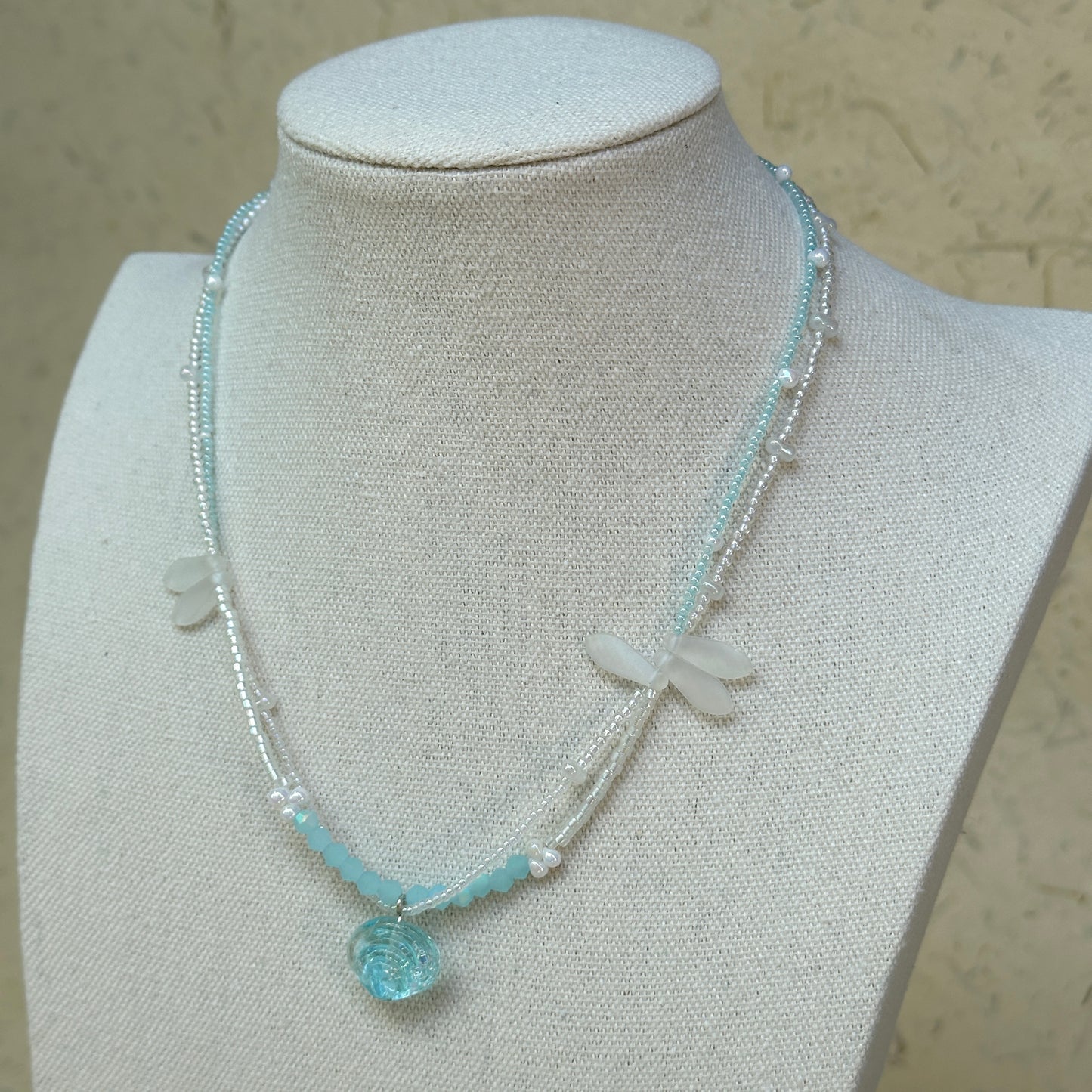 Model wearing Aqua Scallop Charm Necklace, beachy everyday style