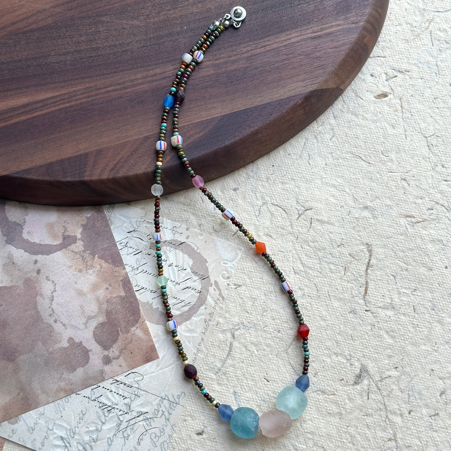 Close-up of aqua, rose, and blue gemstone-style beads