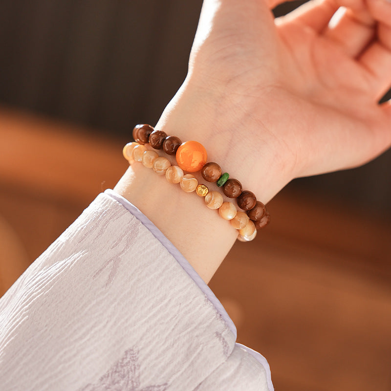 Dual-strand natural stone bracelet with amber centerpiece and shell beads in warm brown and beige tones – Glazenya light luxury jewelry