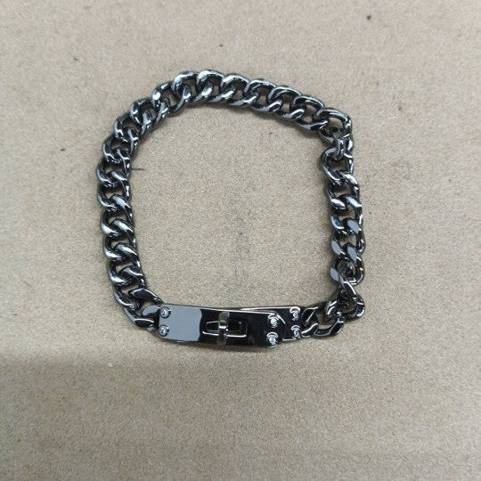 LockChain Minimalist Bracelet in silver, gold, and black metal chain with lock clasp design, displayed on wrist