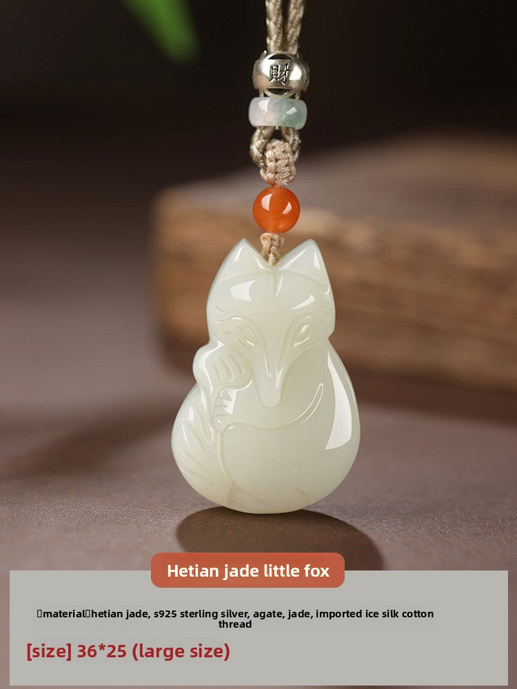 Hand-carved Hetian jade fox pendant on braided cord — Peach Blossom Hetian Jade Fox Pendant