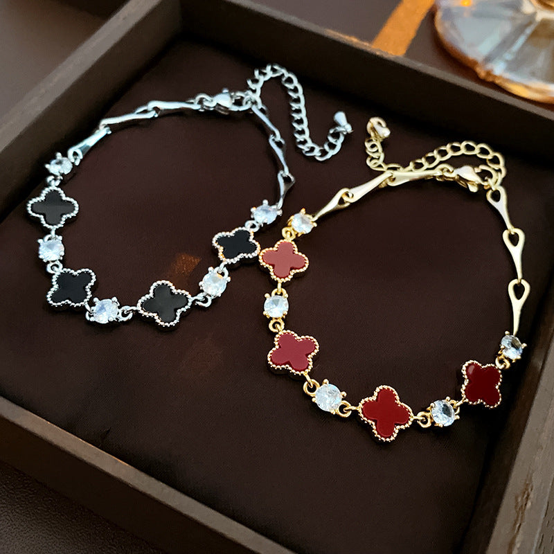 Red enamel clover bracelet with zircon accents and gold tone chain – Glazenya