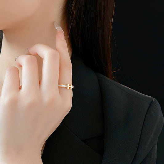 Gold-tone open ring with initial bridge and channel-set pavé cubic zirconia — Lumière Initial Pavé Open Ring.