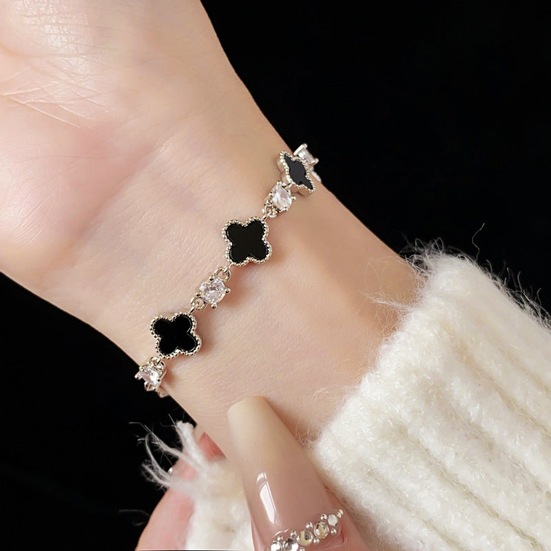 Red enamel clover bracelet with zircon accents and gold tone chain – Glazenya