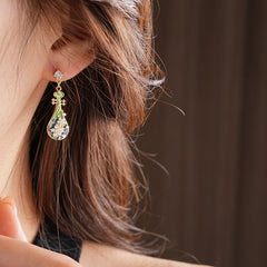 Gold-tone filigree drop earrings with green and blue enamel lute motifs, accented by zircons and tiny pearls — Verdant Lute Filigree Drops.