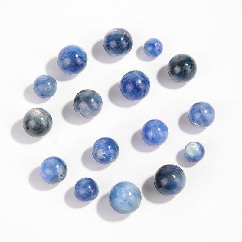 Natural blue kyanite round beads showing cat’s-eye sheen and striations — Sea-Squall Gaze (8–12 mm).