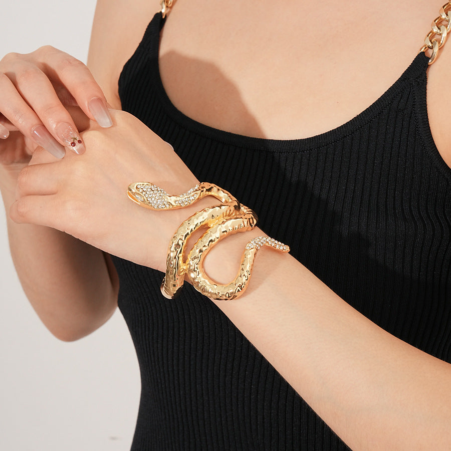 Serpent Luxe Cuff bracelet in gold and silver with rhinestone snake design