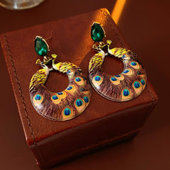 Statement earrings with peacock feather hoop design and emerald stud – Peacock Glory Statement Earrings.