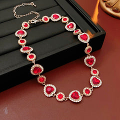 Crimson Heart Luxe Collection with red heart gemstone necklace, bracelet, and earrings, accented with pavé details