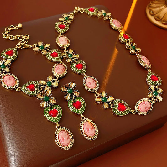 Royal Garden Cameo Set with gold-tone floral links, pink cameo ovals, green enamel hearts, and red stones