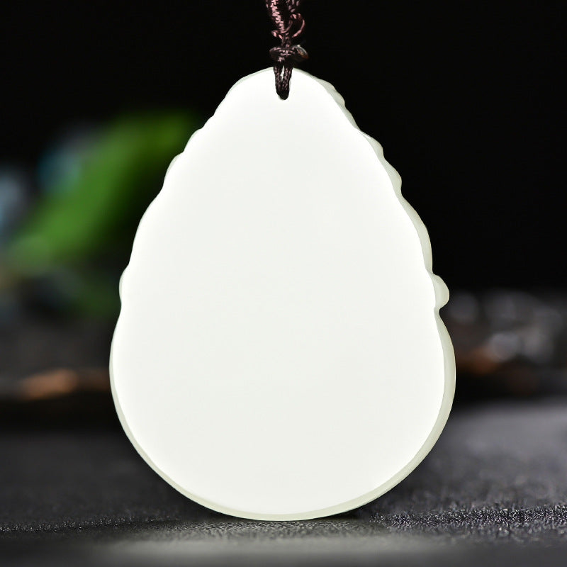 Hetian (nephrite) white jade Guanyin pendant close-up – Lotus Mercy, 57×44×7 mm