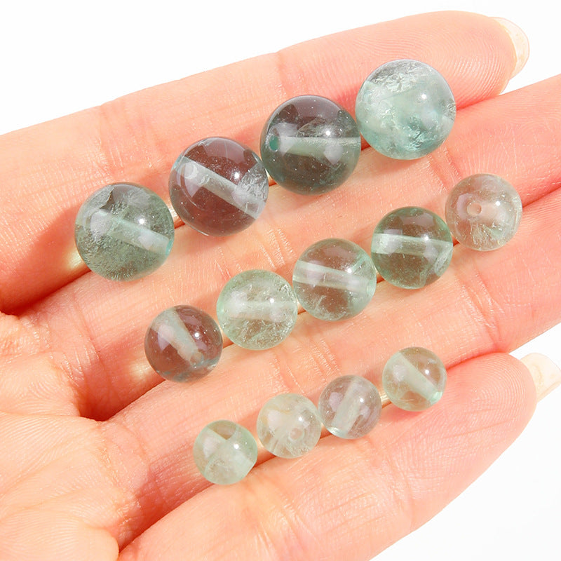 Watery mint-green fluorite round beads with translucent swirls — Mint Spring.