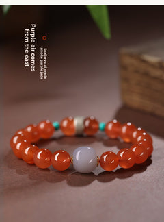 Collectible-grade Hetian jade bracelet with high-ice red agate centerpiece and turquoise accents — Crimson Serenity Hetian Jade Bracelet.