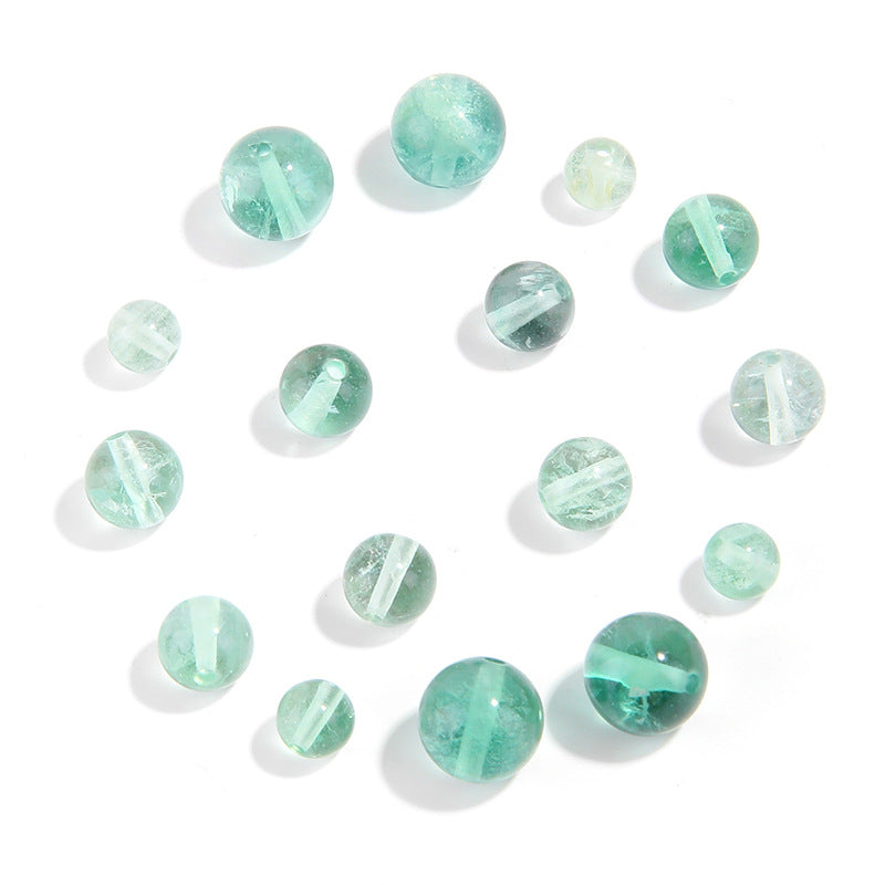 Watery mint-green fluorite round beads with translucent swirls — Mint Spring.