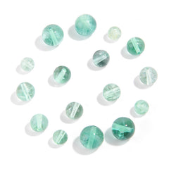 Watery mint-green fluorite round beads with translucent swirls — Mint Spring.