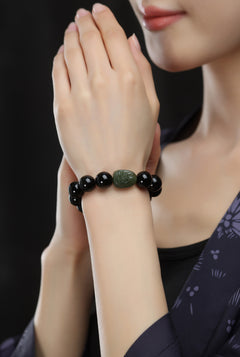 Serene Aegis – Obsidian & Hetian Jade Birth Buddha