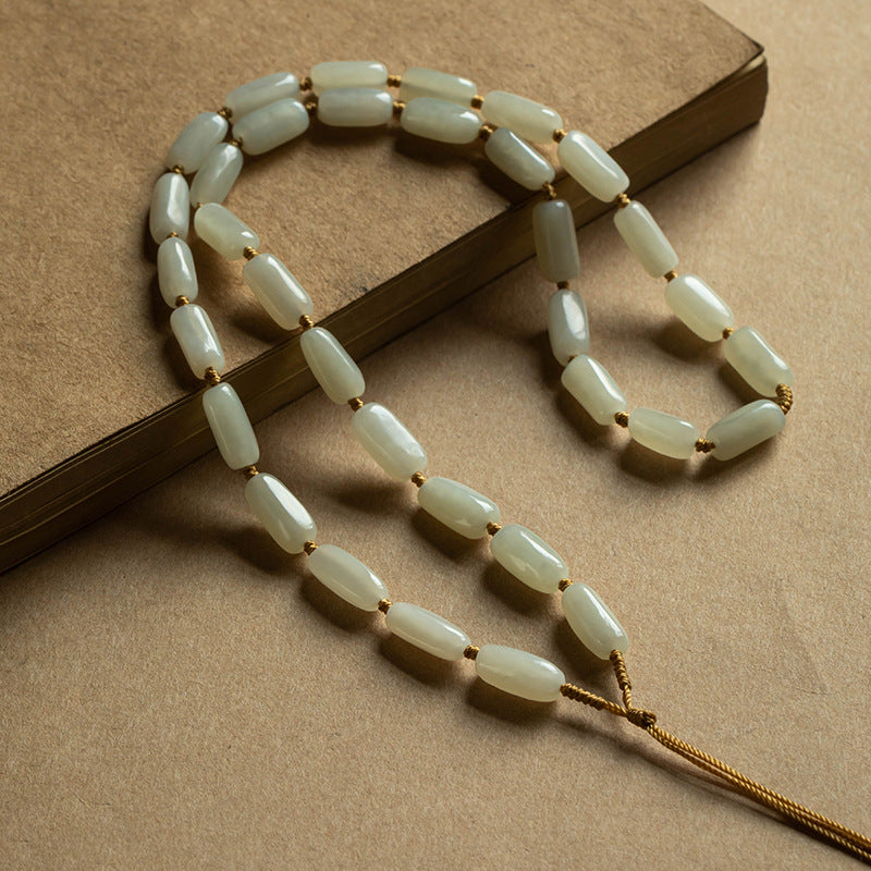 Handcrafted pendant cords wrapped with natural Hetian jade tube beads in light and dark brown — Snowglow Hetian Jade Pendant Cord.