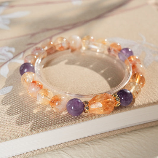 Sunset Harmony Crystal Bangle with yellow crystal and tiger-eye beads, gold-tone spacers, and a clear ring core.