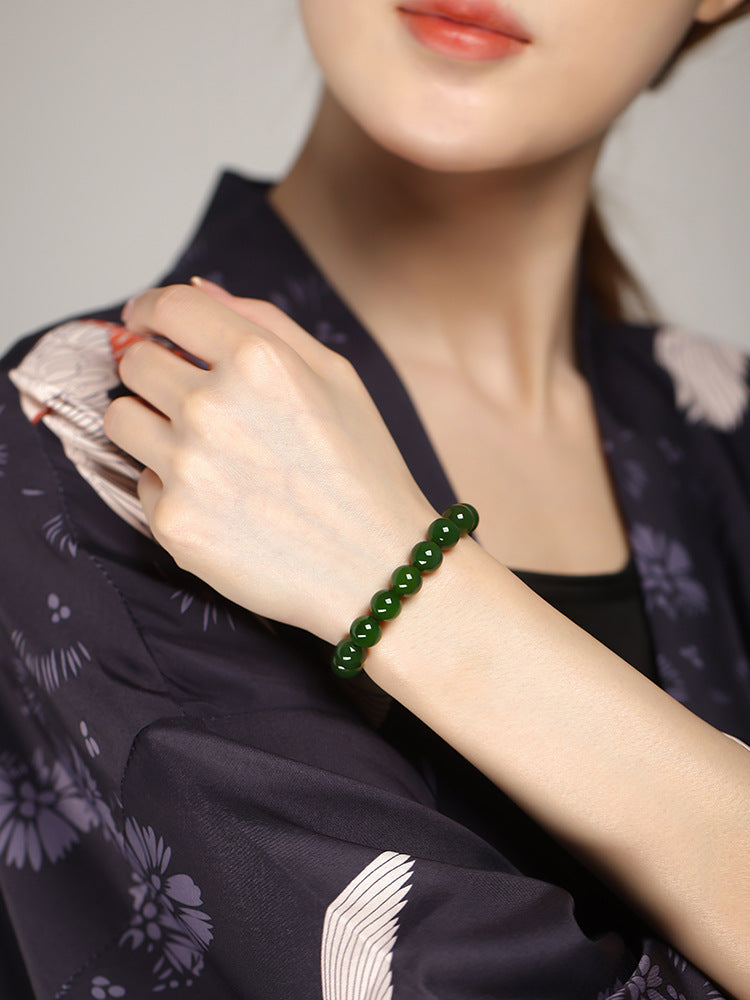 Deep green Hetian (nephrite) jade bracelet with polished round beads — Verdant Fortune Hetian Jade Bracelet.