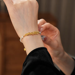 Gold link and pearl chain bracelet with zircon accents on green velvet background – Celestial Pearl Chain Bracelet by Glazenya