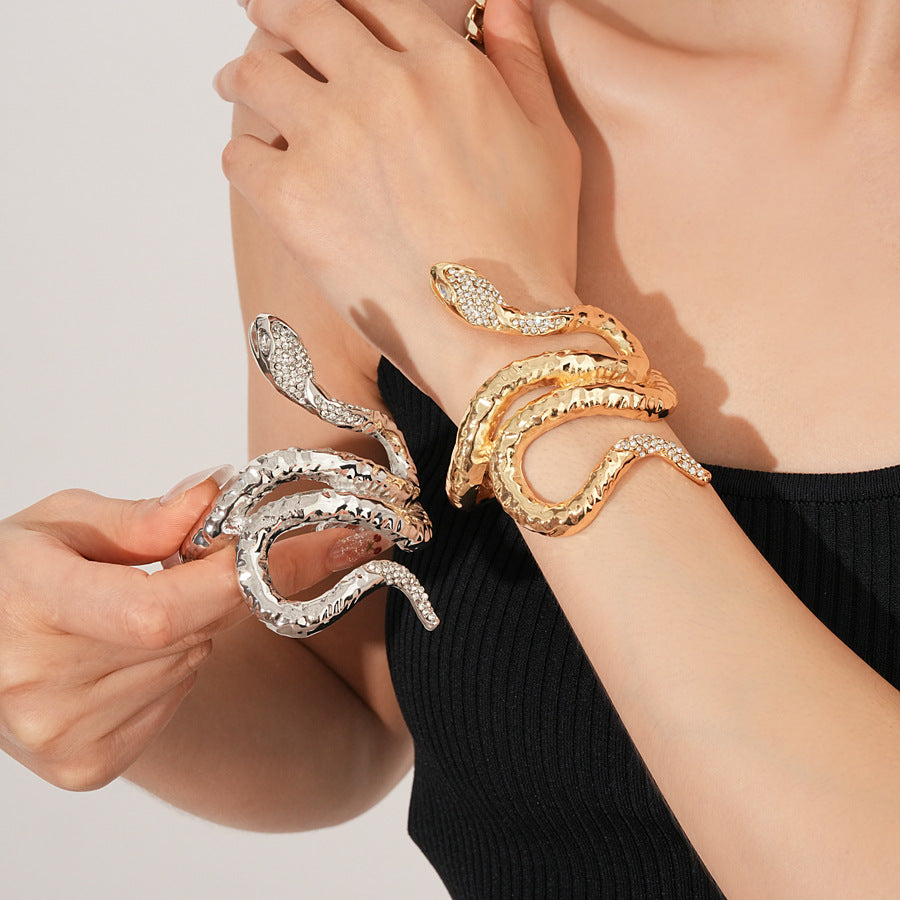 Serpent Luxe Cuff bracelet in gold and silver with rhinestone snake design