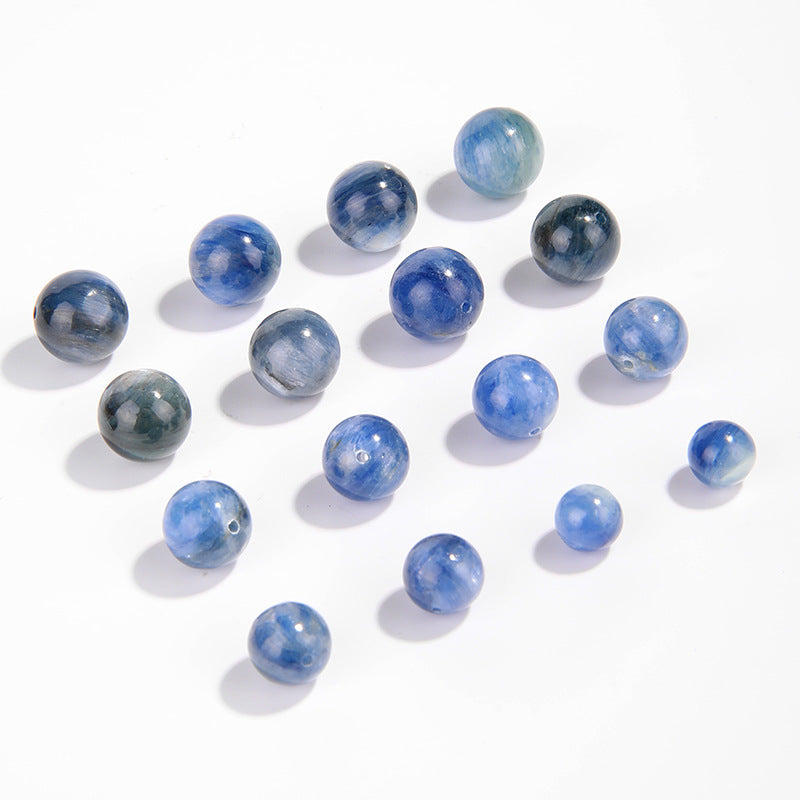 Natural blue kyanite round beads showing cat’s-eye sheen and striations — Sea-Squall Gaze (8–12 mm).