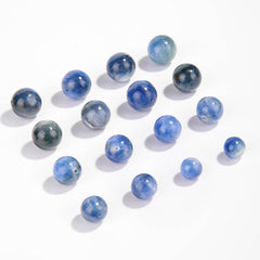 Natural blue kyanite round beads showing cat’s-eye sheen and striations — Sea-Squall Gaze (8–12 mm).