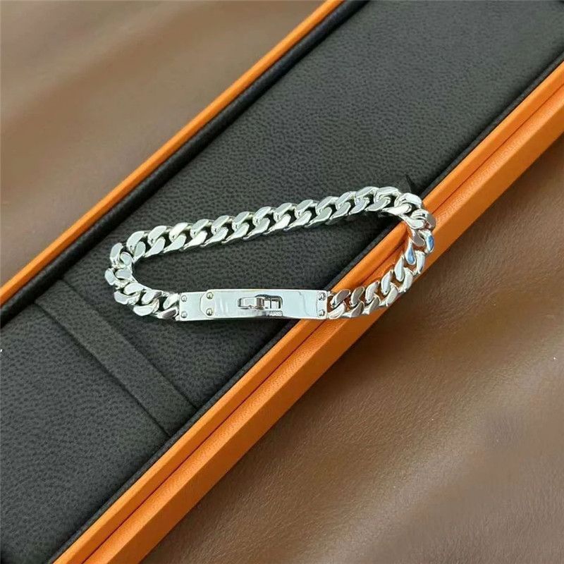 LockChain Minimalist Bracelet in silver, gold, and black metal chain with lock clasp design, displayed on wrist