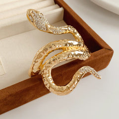 Serpent Luxe Cuff bracelet in gold and silver with rhinestone snake design