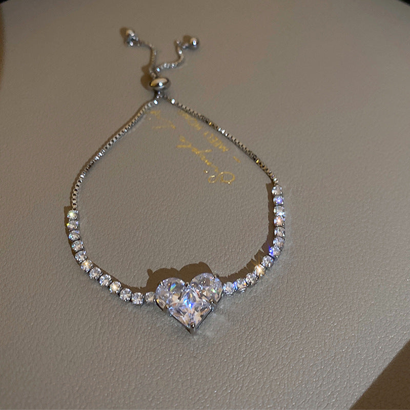 Gold-plated bracelet collection with pearls, cat’s eye stones, and floral motifs
