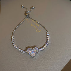 Gold-plated bracelet collection with pearls, cat’s eye stones, and floral motifs