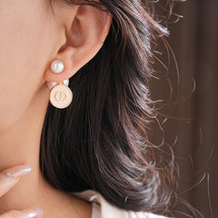 Elegant double pearl stud earrings with bee and emblem coin charms — Bee & Emblem Double Pearl Studs.