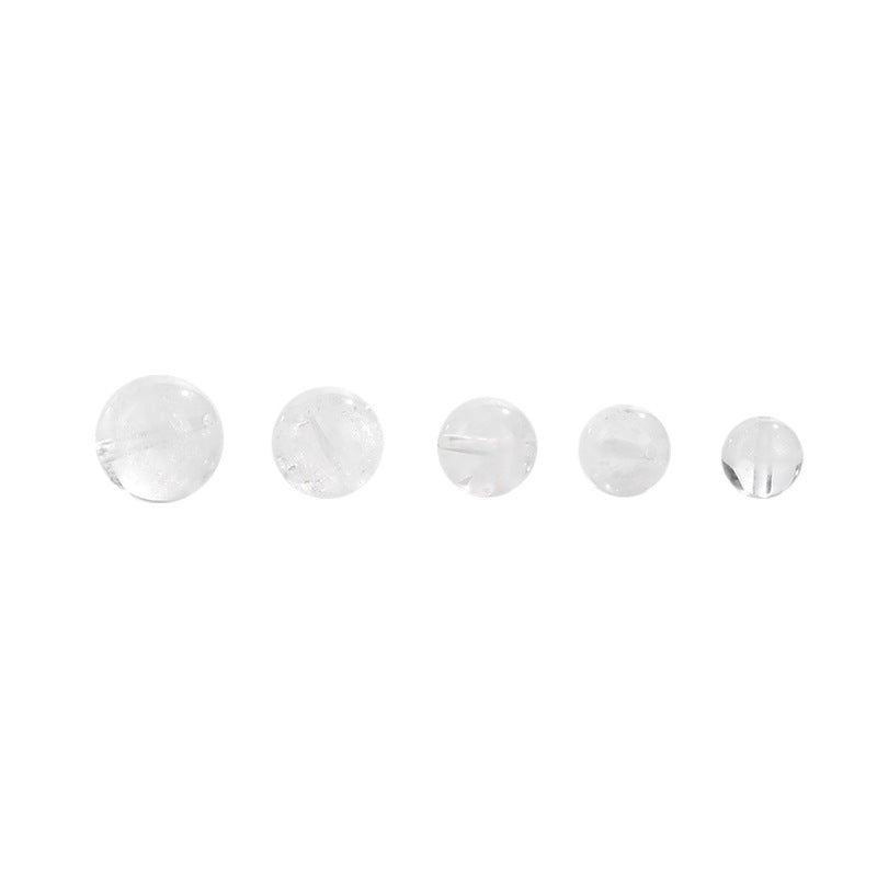 Clear quartz crystal rounds with white phantom inclusions and faint rainbow flash — Frostbow Atrium (7–14 mm).