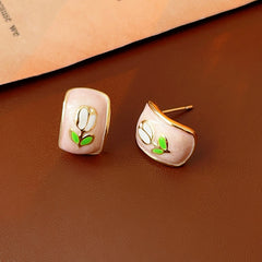 Blush-pink enamel rectangular studs with tulip motif and gold rim — Blush Tulip Cameo Studs.