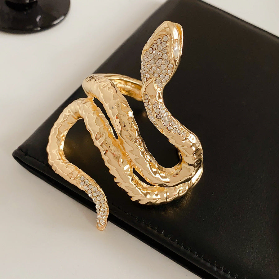 Serpent Luxe Cuff bracelet in gold and silver with rhinestone snake design