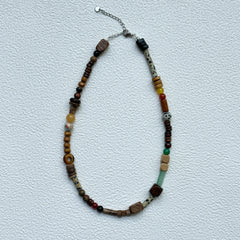 Full view of Desert Caravan Necklace hanging – warm desert palette with relaxed bohemian asymmetry