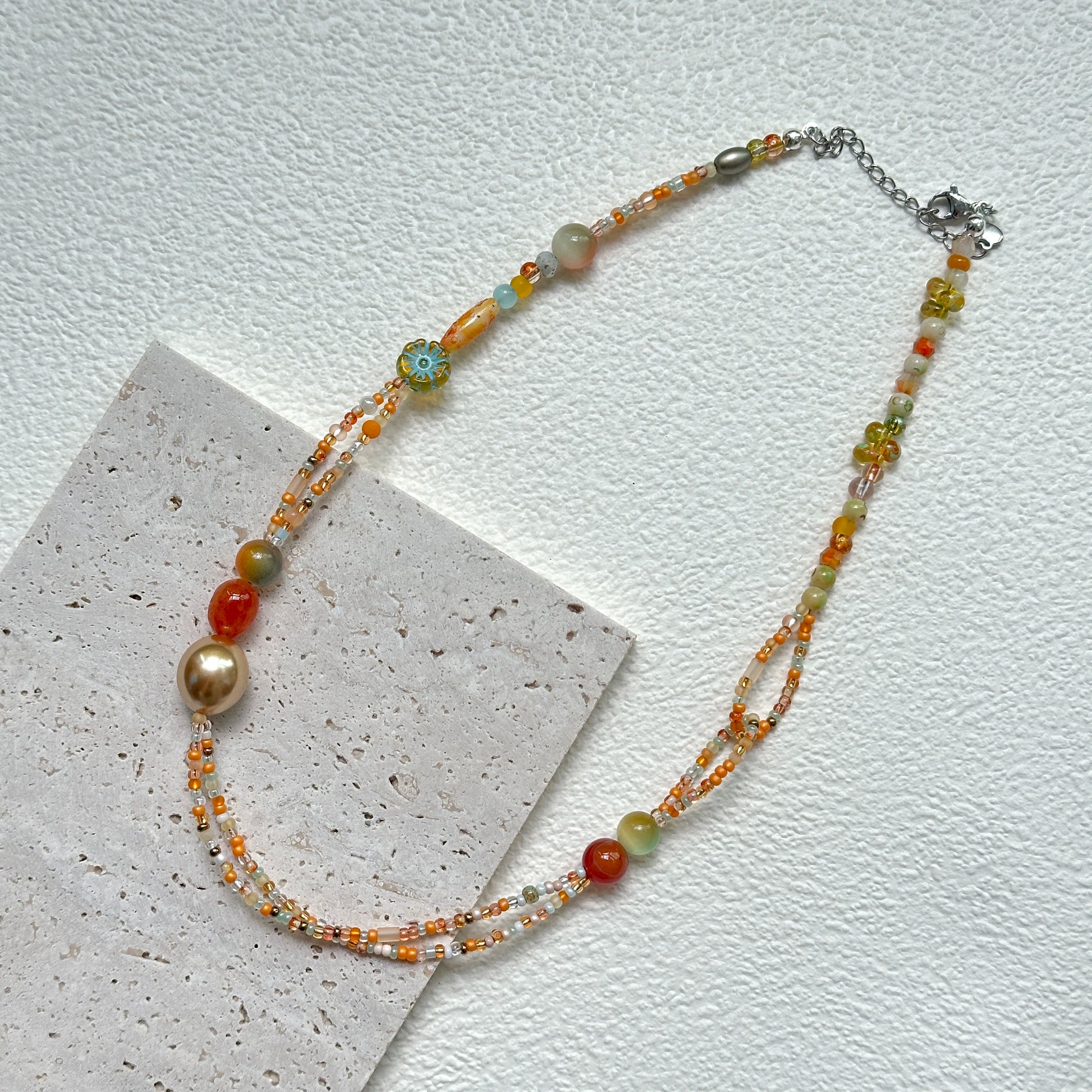 Golden Ember Necklace handcrafted beadwork in golden and red hues