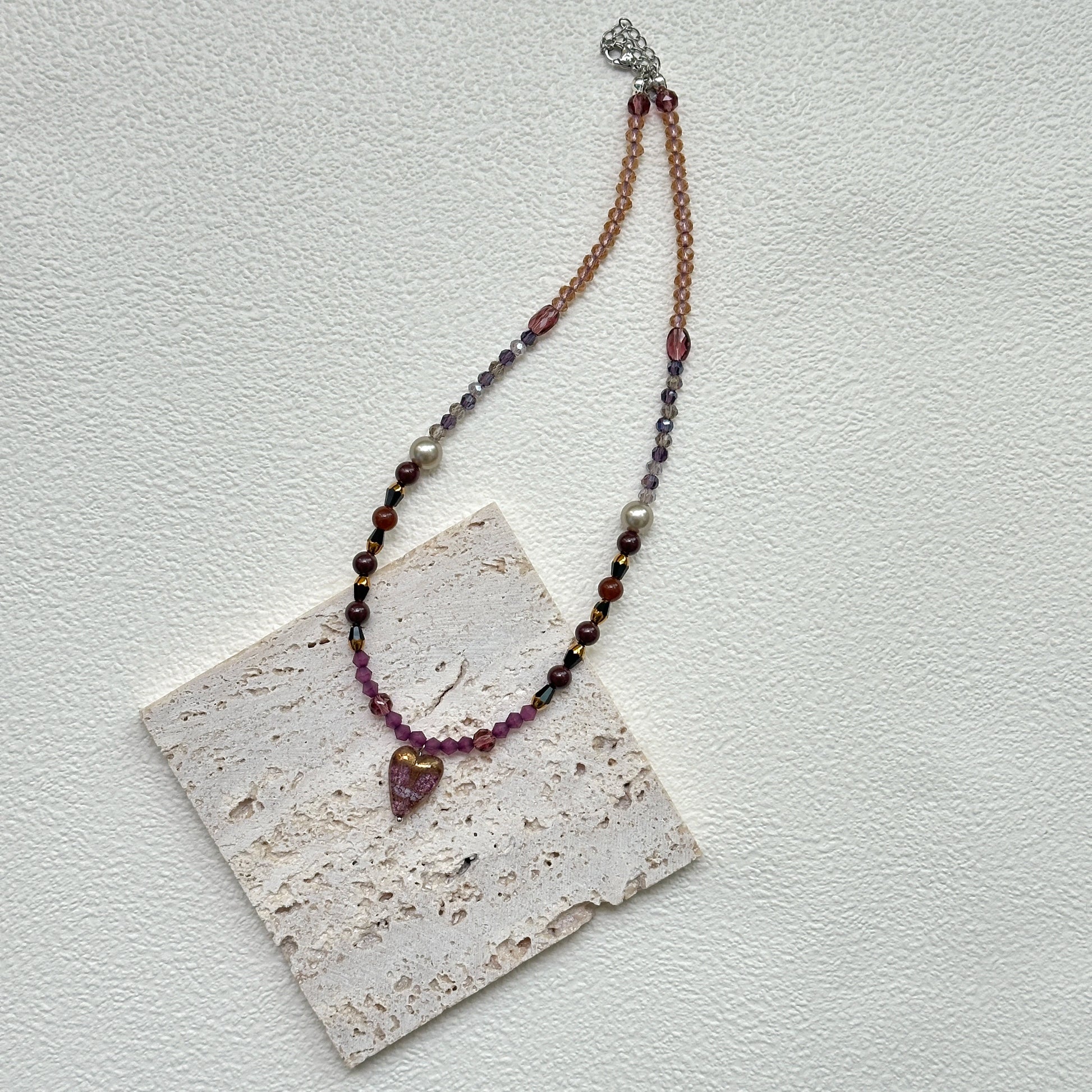 Amour Heart Necklace styled on white background card – handmade blush glass heart pendant necklace with burgundy and gold beads by Glazenya