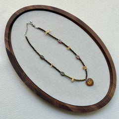 Aurora Heart Necklace laid flat, showing vibrant beadwork and heart-shaped pendant