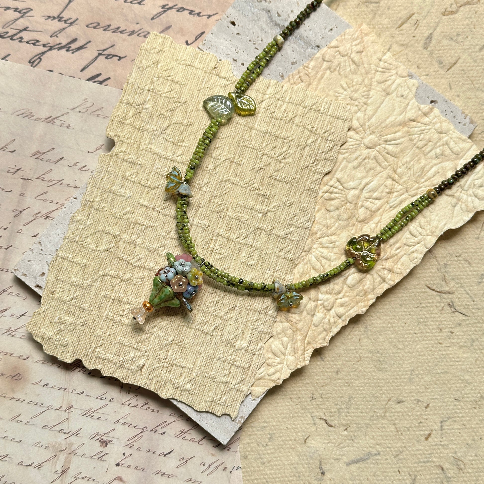 Model wearing Meadow Posy Charm Necklace, light floral style