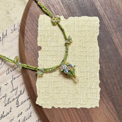 Handmade necklace with tiny bouquet (posy) charm, green seed beads and leaf accents – Glazenya