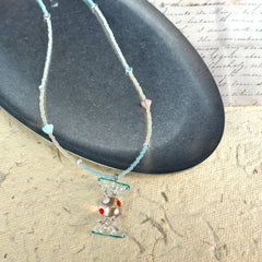 Ocean Bonbon Necklace — close-up highlighting red-dot glass candy pendant and pastel beads1