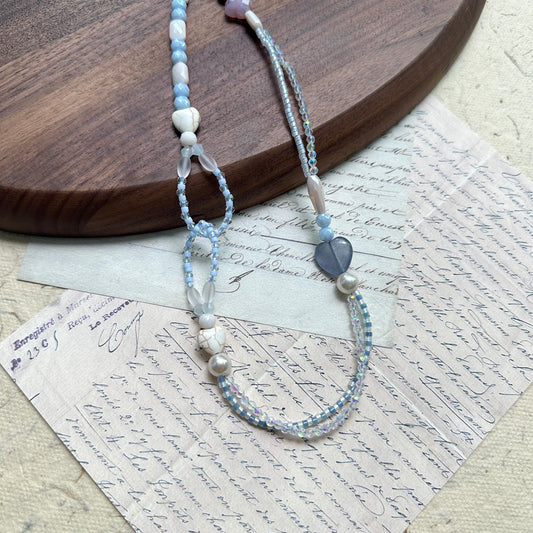 Lunar Mist Necklace — close-up highlighting the loop detail, heart accent, and faceted glass beads