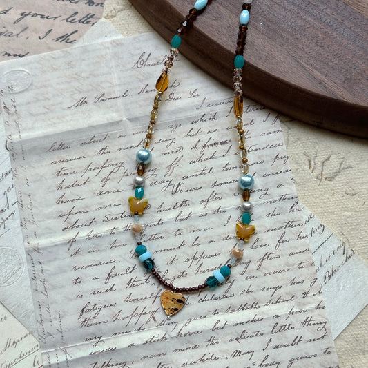 Handmade necklace with amber heart pendant, turquoise and pearl accents – Glazenya