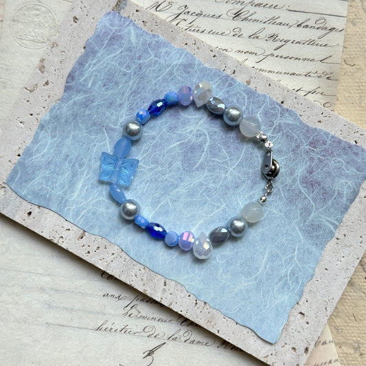 Azure Butterfly Bracelet with blue crystal beads and butterfly charm